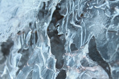 Close-up of curling stones sliding on ice with clear markings.
