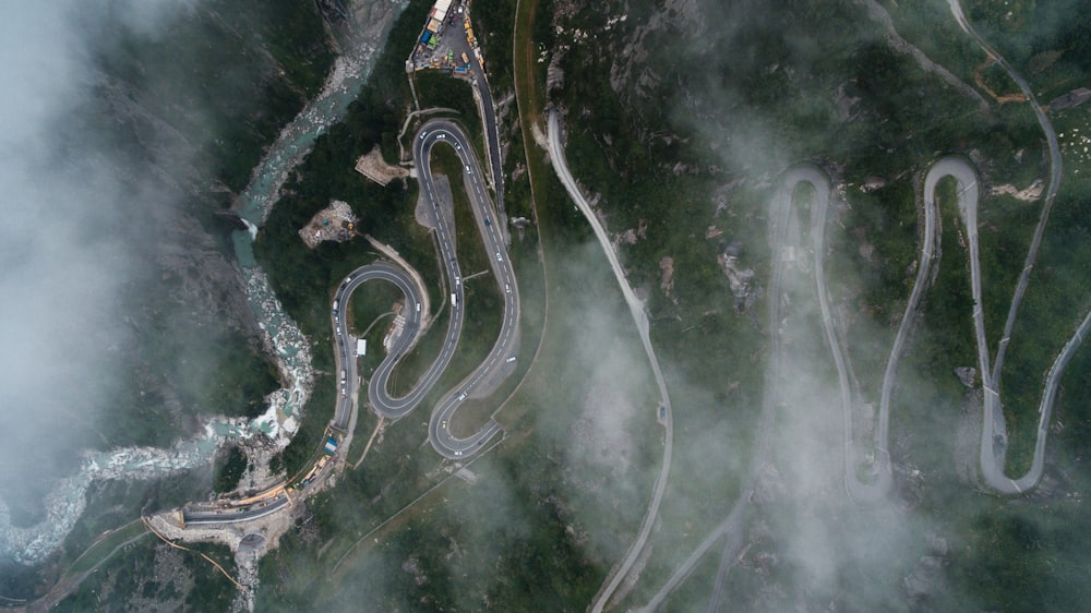 bird's eye view photography of curved pave road