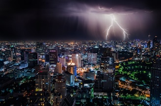 aerial view of city buildings with lightning strike