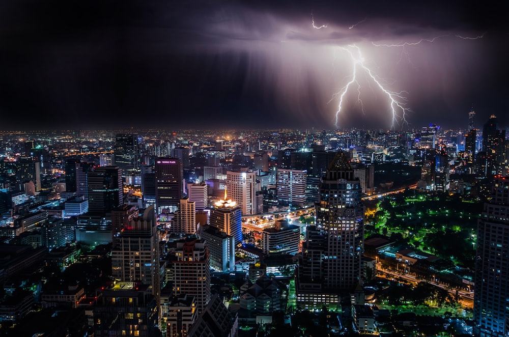 aerial view of city buildings with lightning strike
