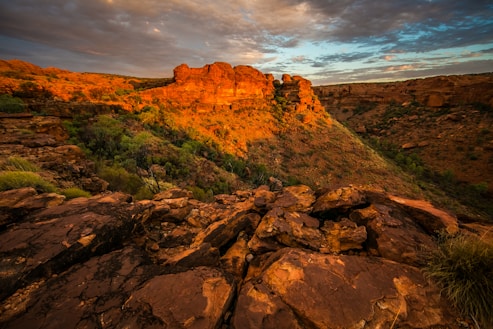 aerial view of rock cliffs under cloudy sky