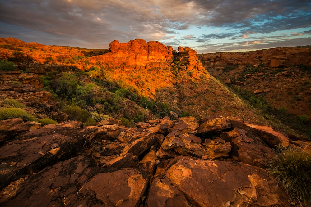 aerial view of rock cliffs under cloudy sky