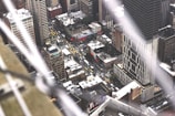 An aerial view of taxis in motion during a vibrant city event.