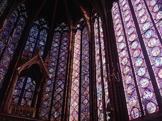 purple stained glass of cathedral
