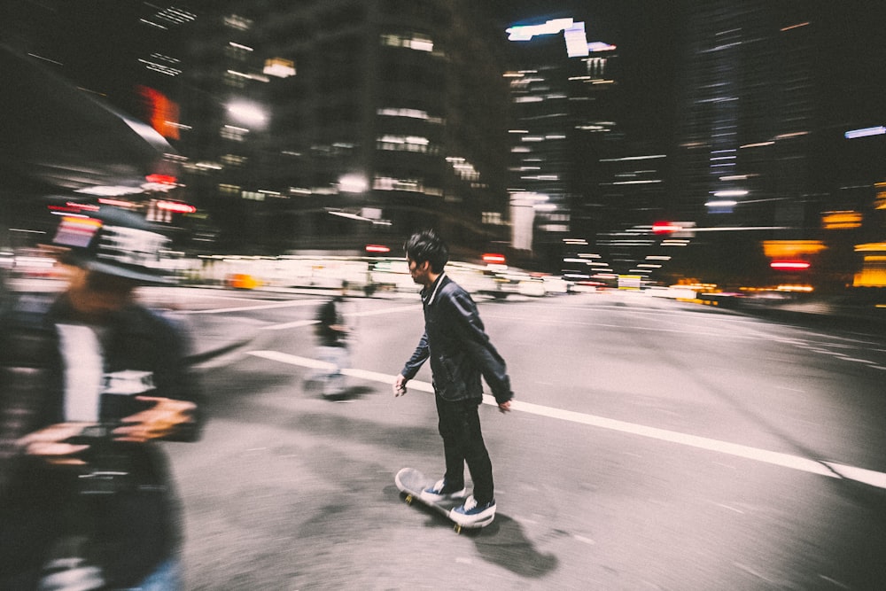 man riding on skateboard on street