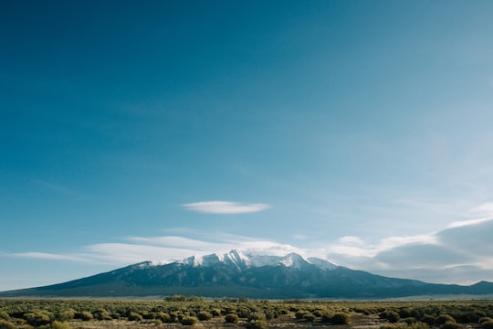 mountain near grass field under cloudy sky in Colorado United States