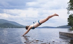 woman diving on water