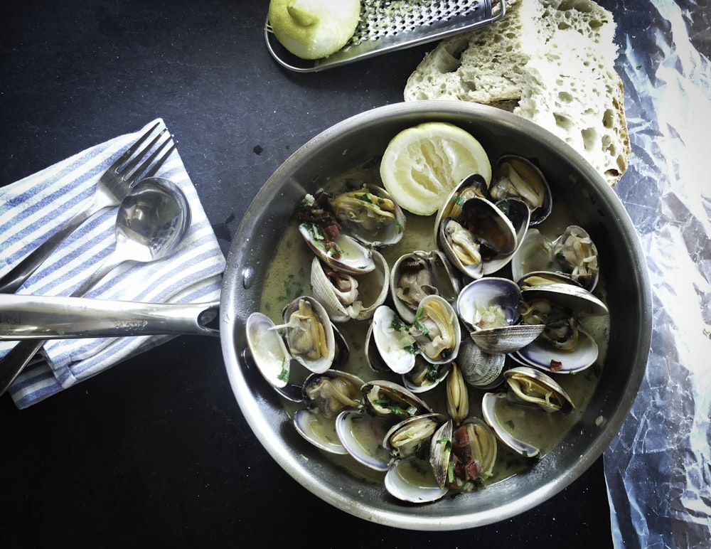 round silver steel bowl with scallops