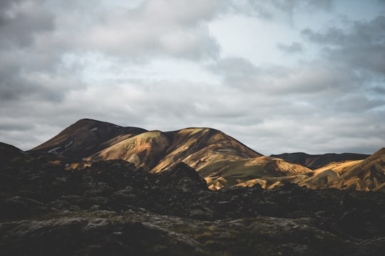 mountain under cloudy sky during daytime in Landmannalaugar Iceland