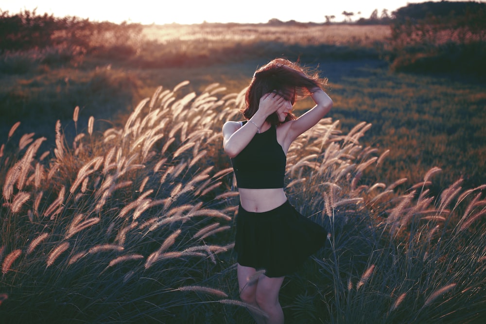 woman dancing on grass field