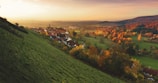 A picturesque village nestled in the hills during autumn.