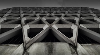 gray concrete building low-angle photography