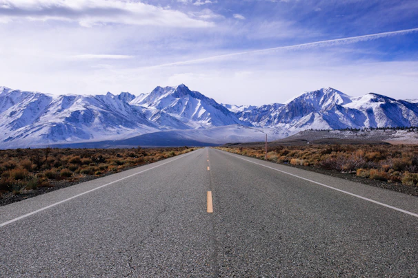 The open road stretching ahead with the mountains looming, hinting at the adventures yet to come.