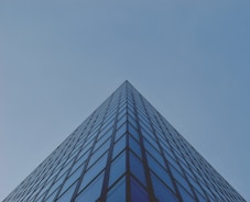 architectural photography of blue glass building