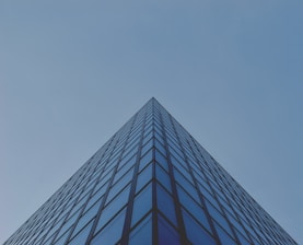 architectural photography of blue glass building
