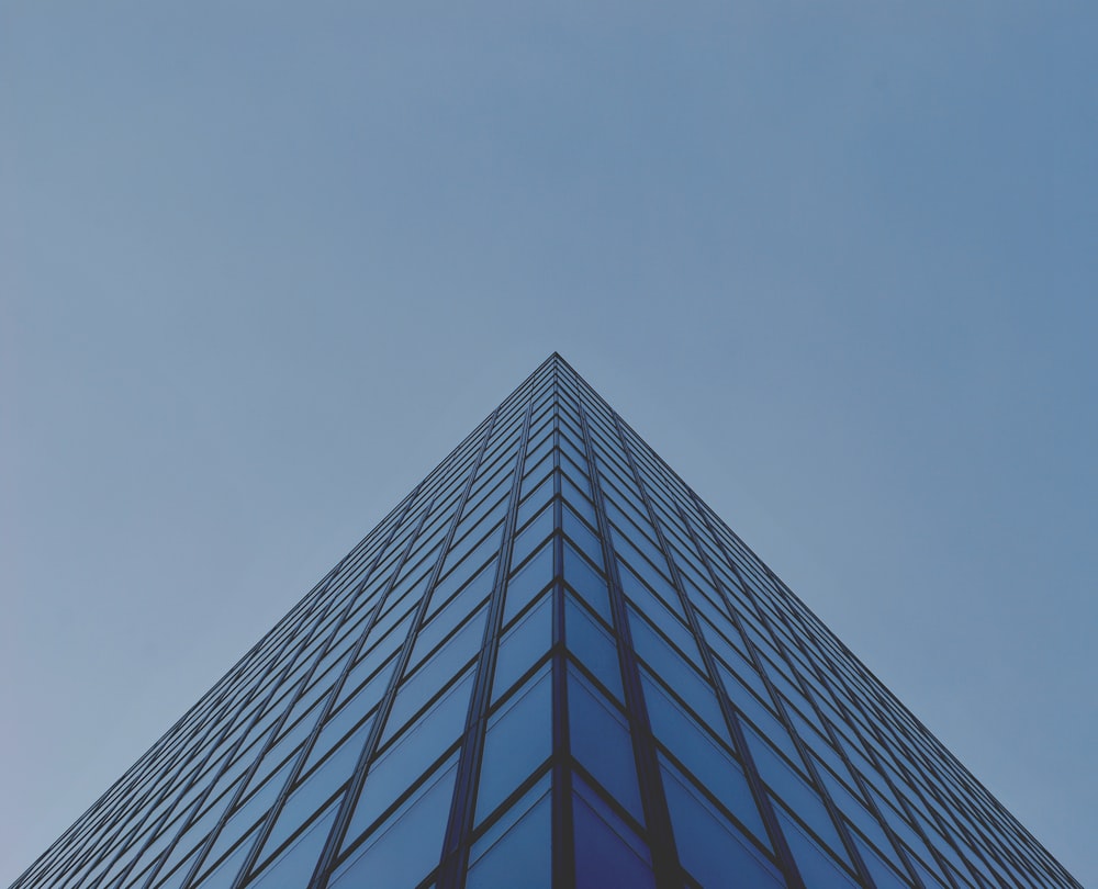 architectural photography of blue glass building