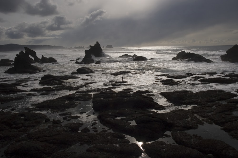 stack landform under cloudy sky nature photography