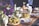 A beautifully arranged table with various dishes and decorations.