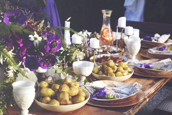 A beautifully arranged table with a variety of dishes and elegant tableware.