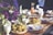 A beautifully arranged table with various dishes and decorations.