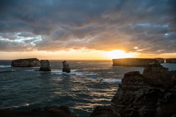 A vibrant sunset over El Nido's limestone cliffs and turquoise waters.