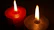 Two candles glowing side by side, symbolizing support and connection.