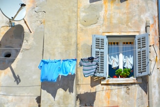 Freshly laundered clothes hanging to dry.