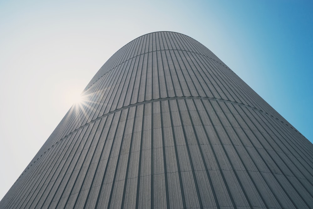 low-angle photography of white high-rise building during daytime