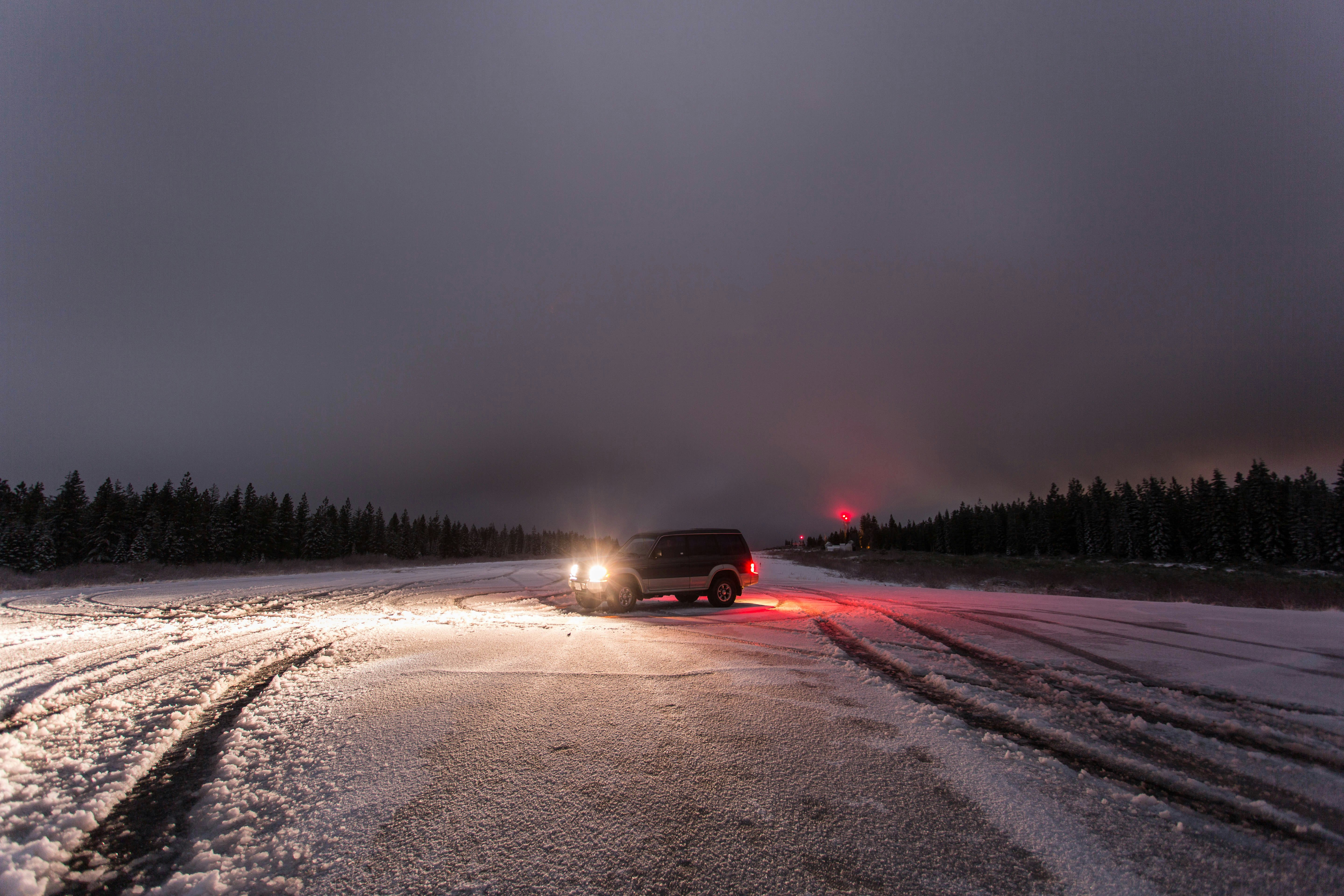 vehicle on snow field during daytime