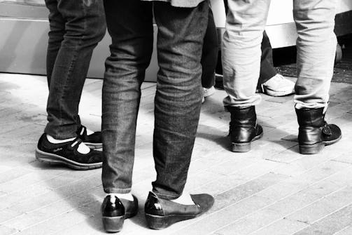 Group photo of shoe industry professionals at a networking event with smiles and badges