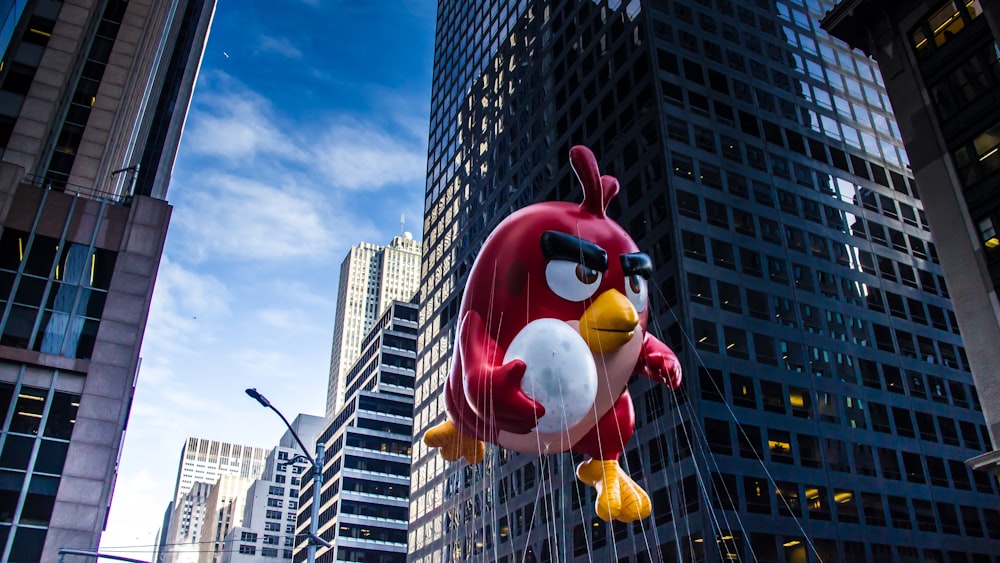 A red angry jumping through the street while holding an egg.