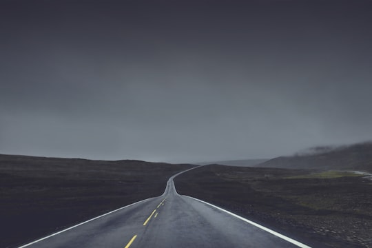 photography of road under cloudy sky in Smalfjord Norway