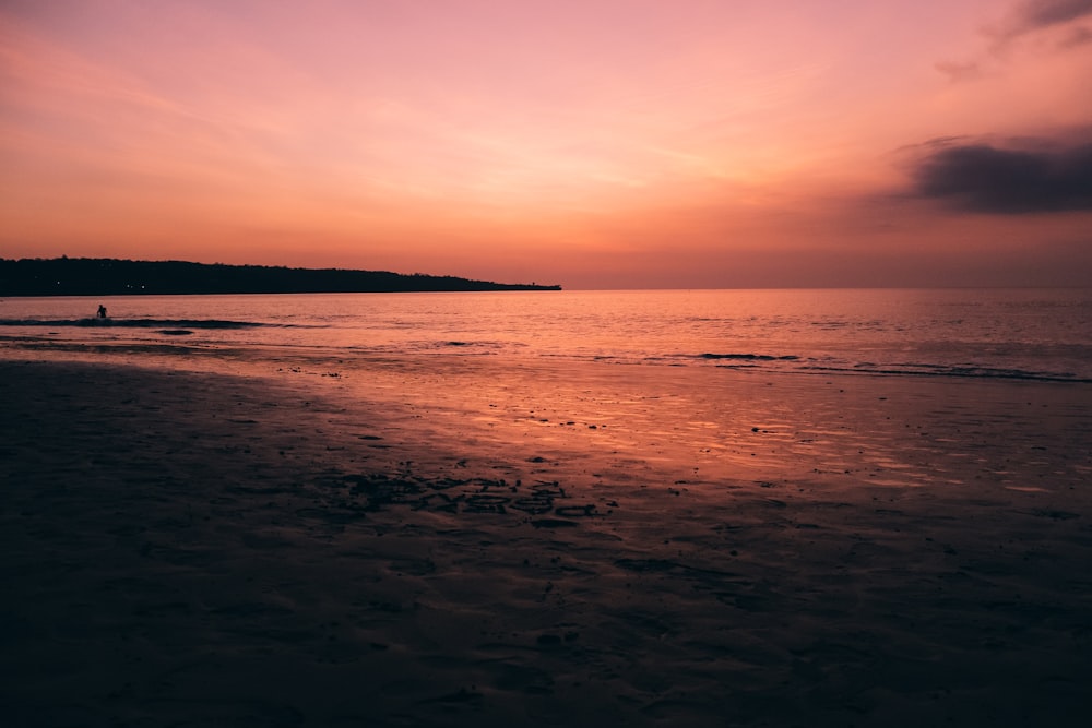 body of water during golden hour