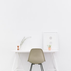 white wooden table near brown chair