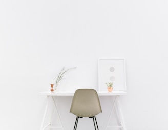 white wooden table near brown chair