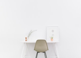 white wooden table near brown chair