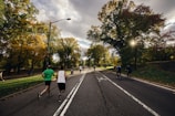 people running and riding bicycle