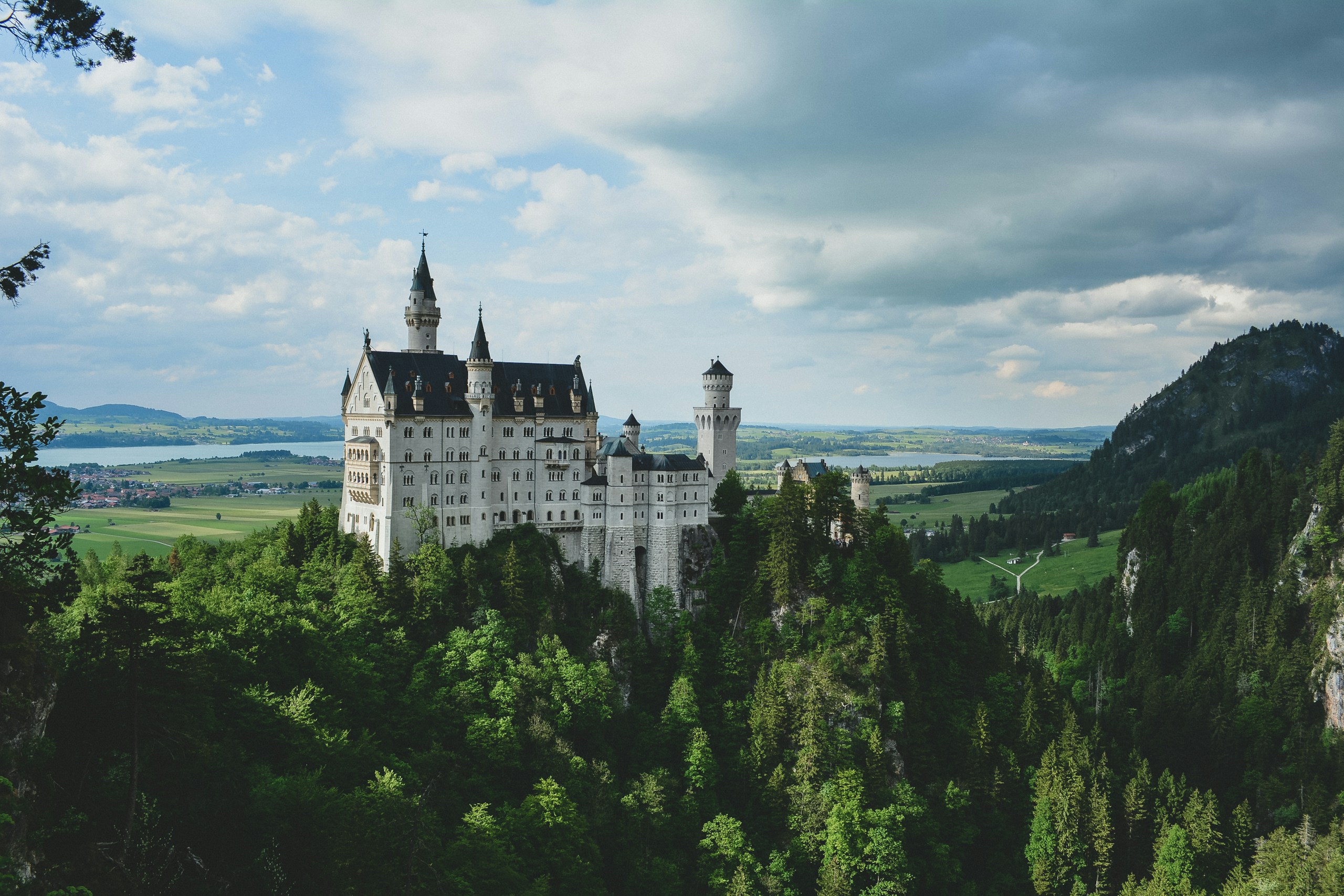 white concrete castle in green field