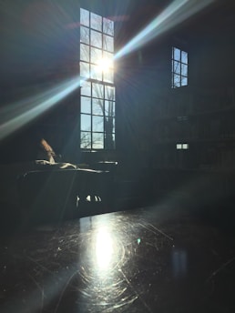 Sunlight streaming through a window onto a stack of motivational storybooks.