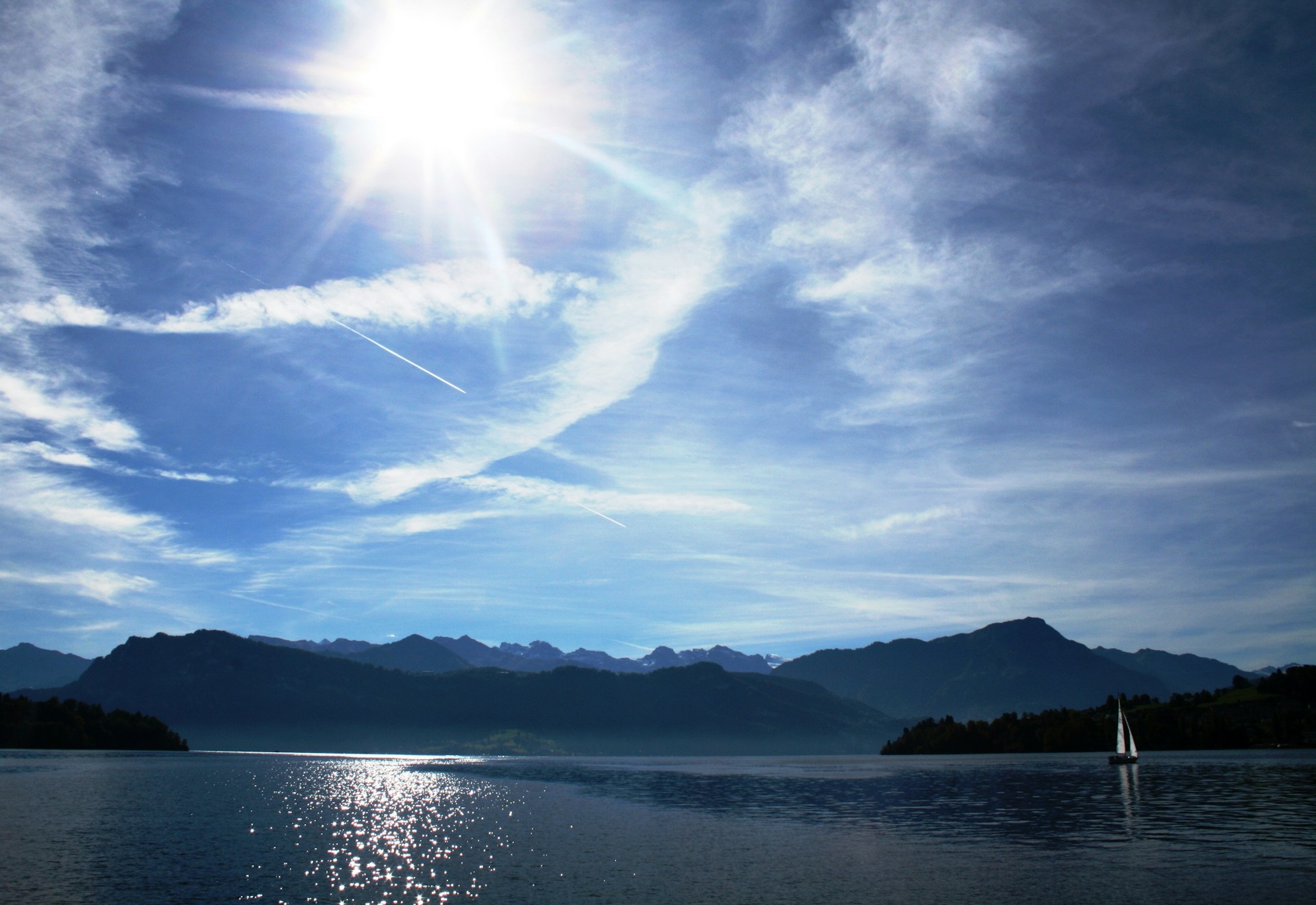 woman wearing yellow long-sleeved dress under white clouds and blue sky during daytime