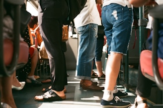 group of person sitting and standing inside the vehicle