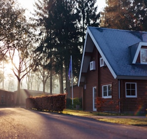 brown and red house near trees