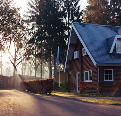 brown and red house near trees