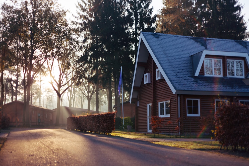 brown and red house near trees