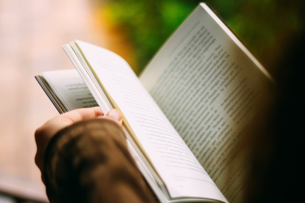 A person leafing through a book