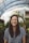 woman smiling while standing in garden