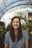 woman smiling while standing in garden