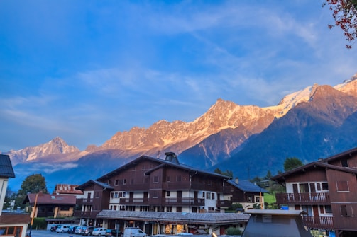 Sunset over a scenic Balkan mountain village welcoming tourists.
