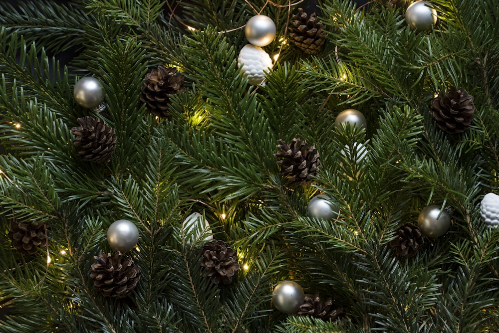 closeup photo of Christmas tree with ornament and lighted lights
