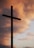 silhouette of large cross under orange sky